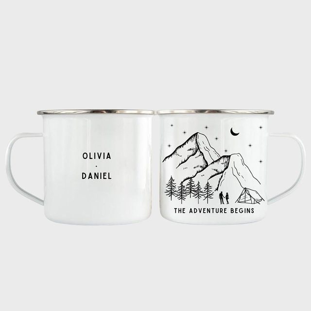 Two white mugs display text, 