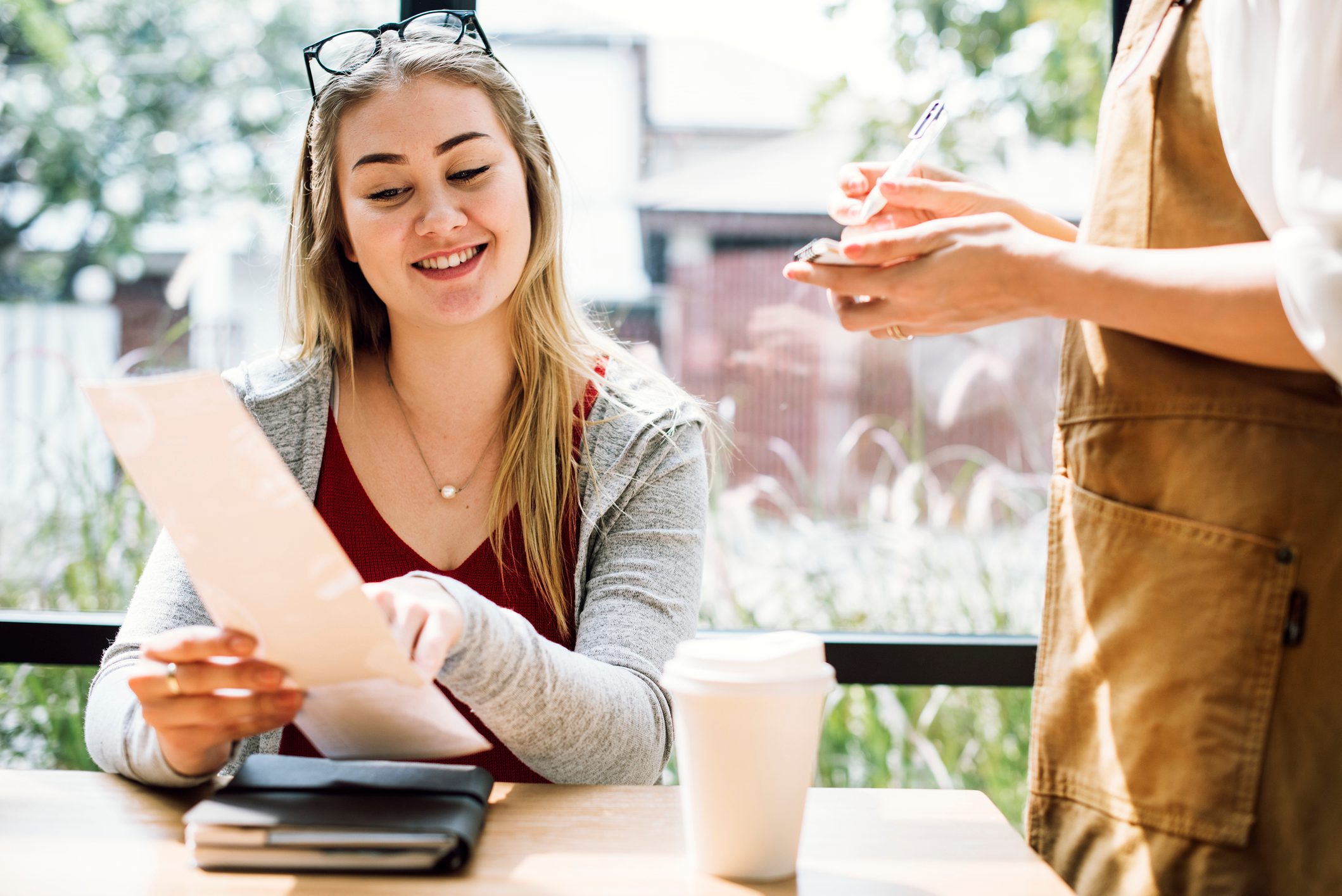 Woman ordering food at the restaurant