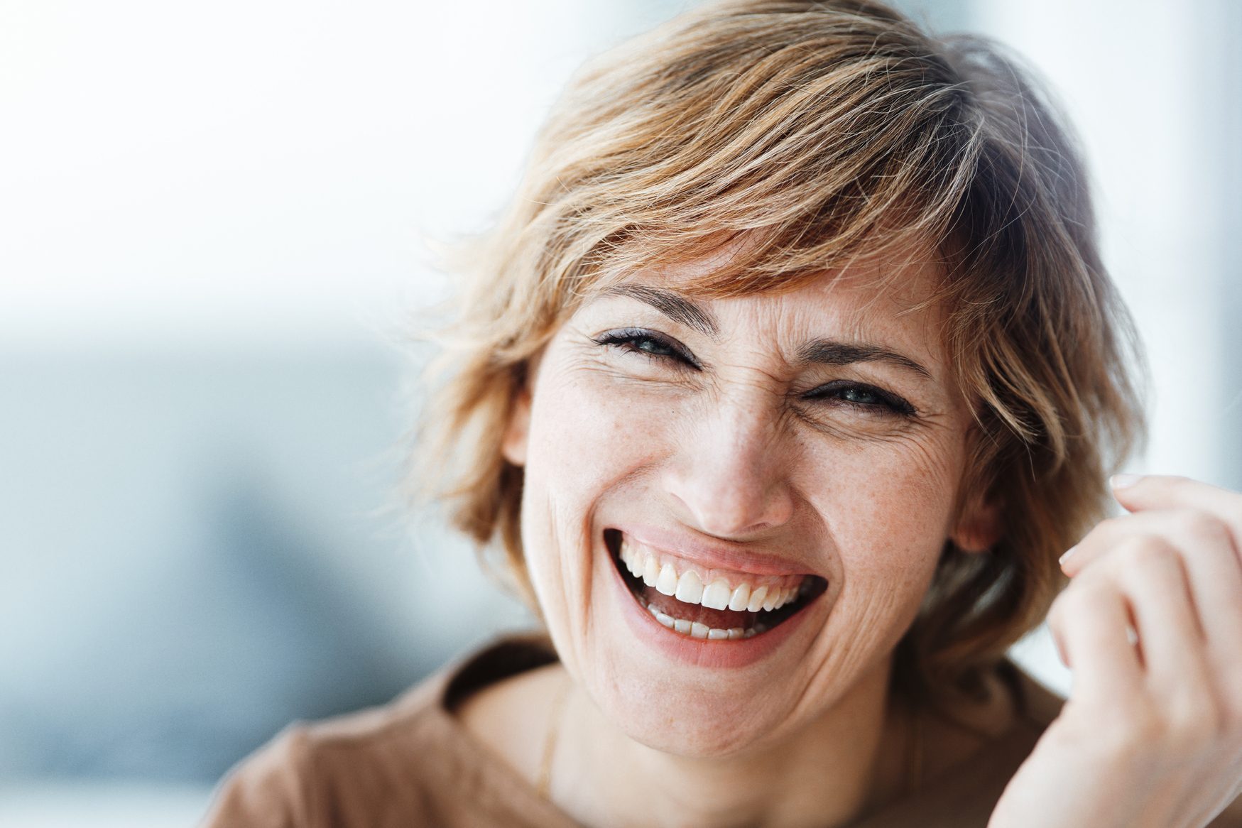 Businesswoman laughing in office
