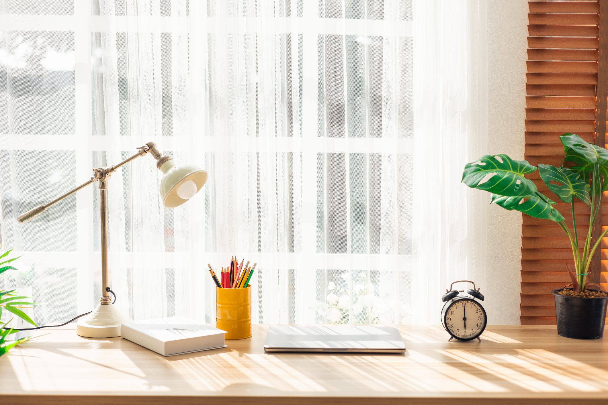 Laptop and Office Supplies on Home Office Desk