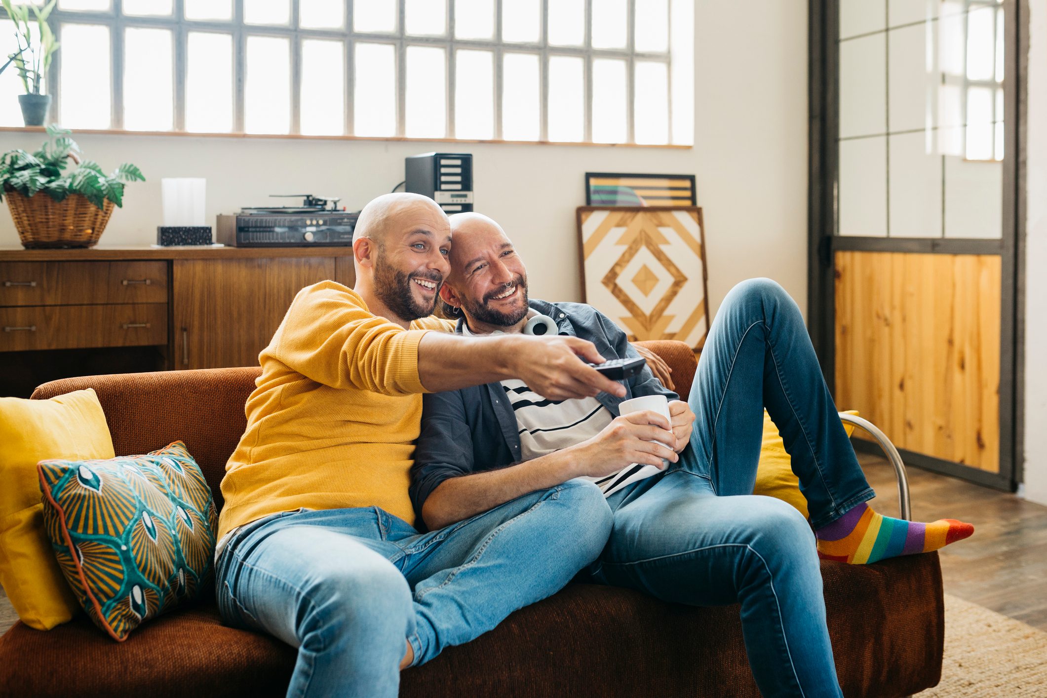 Gay couple relaxing on a couch