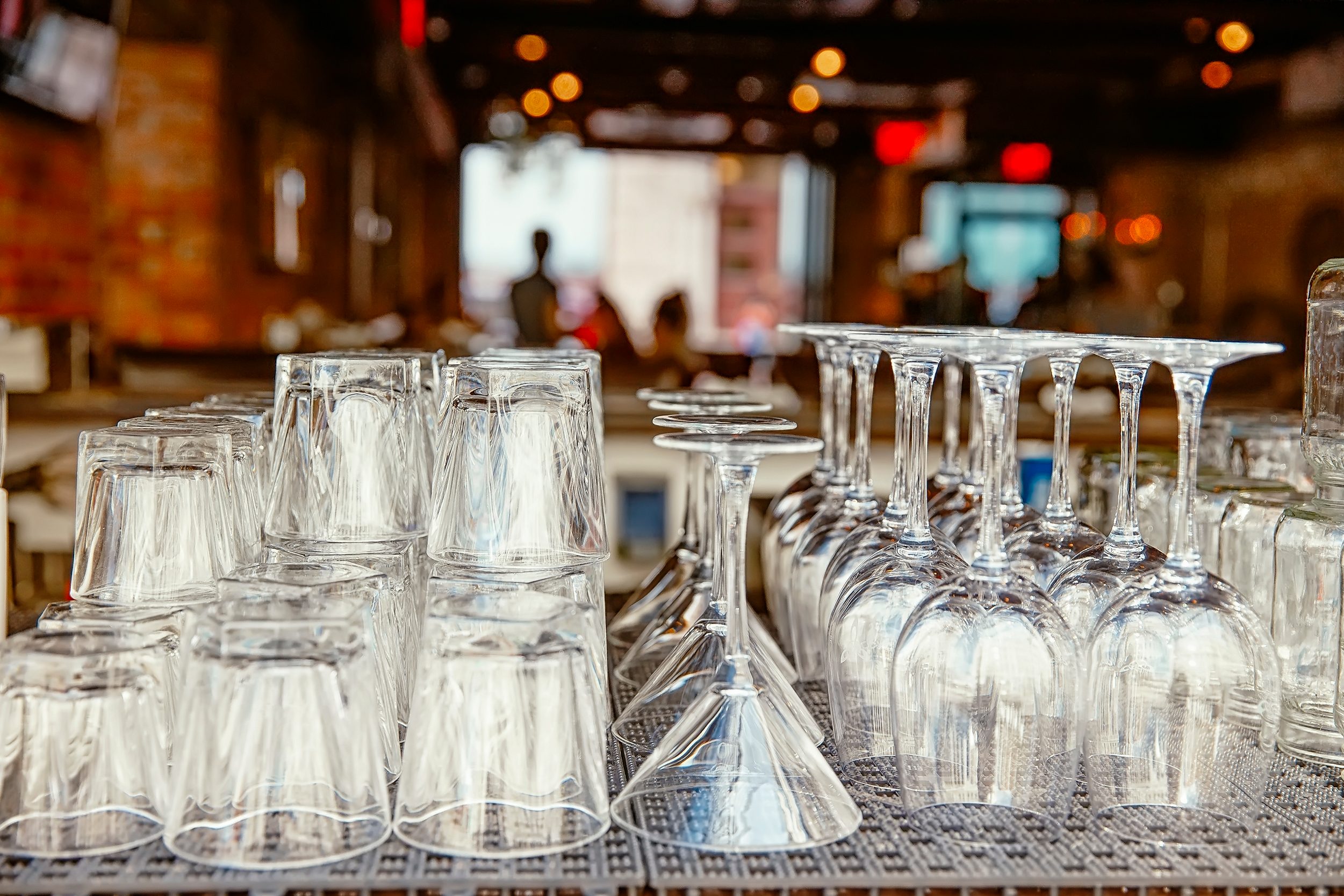 wine glasses on the bar counter in a restaurant