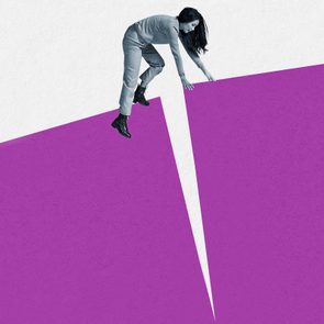 A person balances between two purple shapes, appearing to stretch across a gap, against a minimalist plain background.