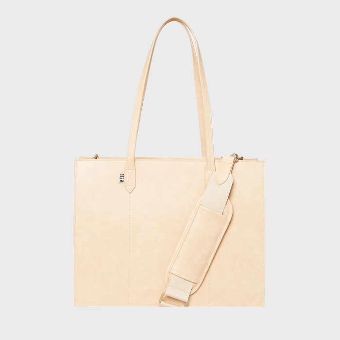 Beige tote bag with long handles, features a detachable shoulder strap; logo 