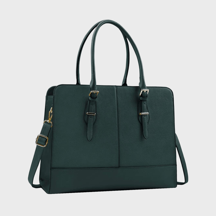 Dark green handbag with two buckled straps and a detachable shoulder strap sits against a plain white background.