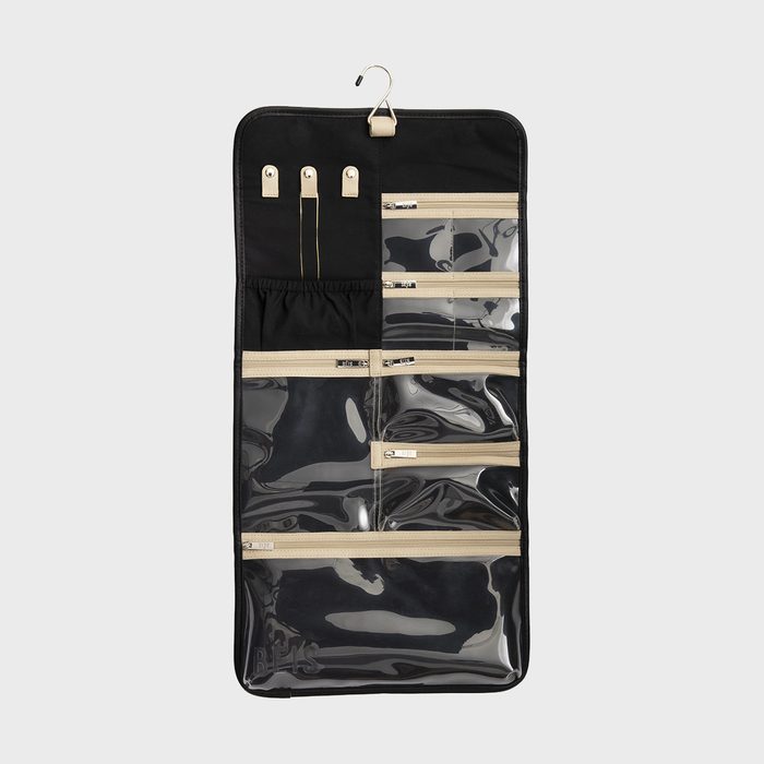 Organizer hanging with multiple clear zippered compartments against a plain background, used for storing toiletries or accessories, featuring a metal hook for easy hanging.