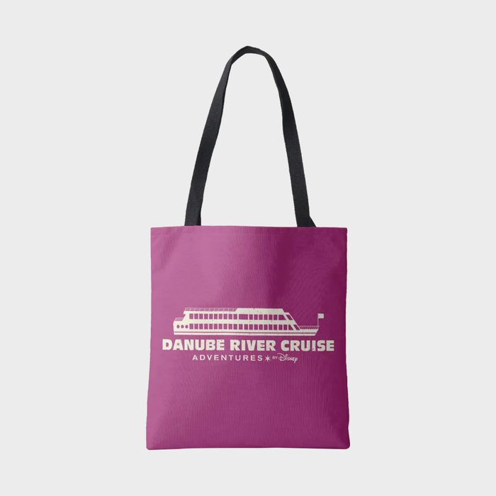 Tote bag displays a cruise ship graphic and text 