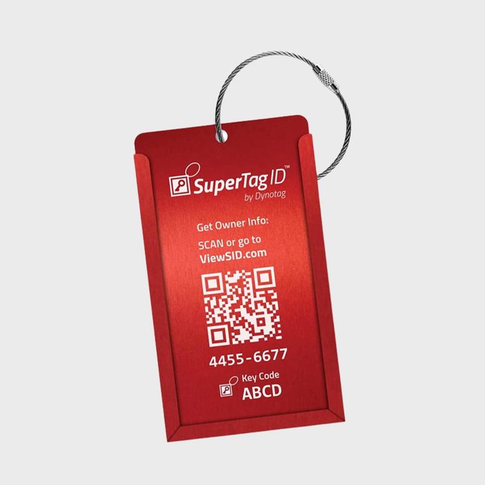 Red luggage tag fastened by a cable features text, QR code; instructs scanning or visiting ViewSID.com, includes code 