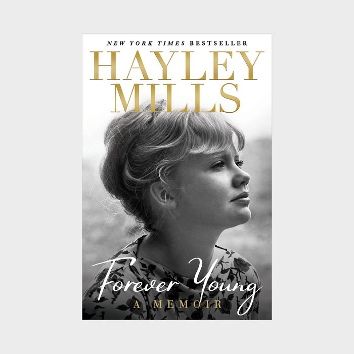 A woman gazes sideways, wearing a floral top, on the book cover featuring 