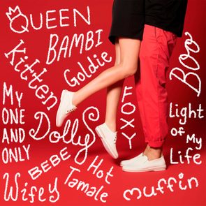 Legs embrace playfully, wearing white sneakers on a red background, surrounded by affectionate terms like 