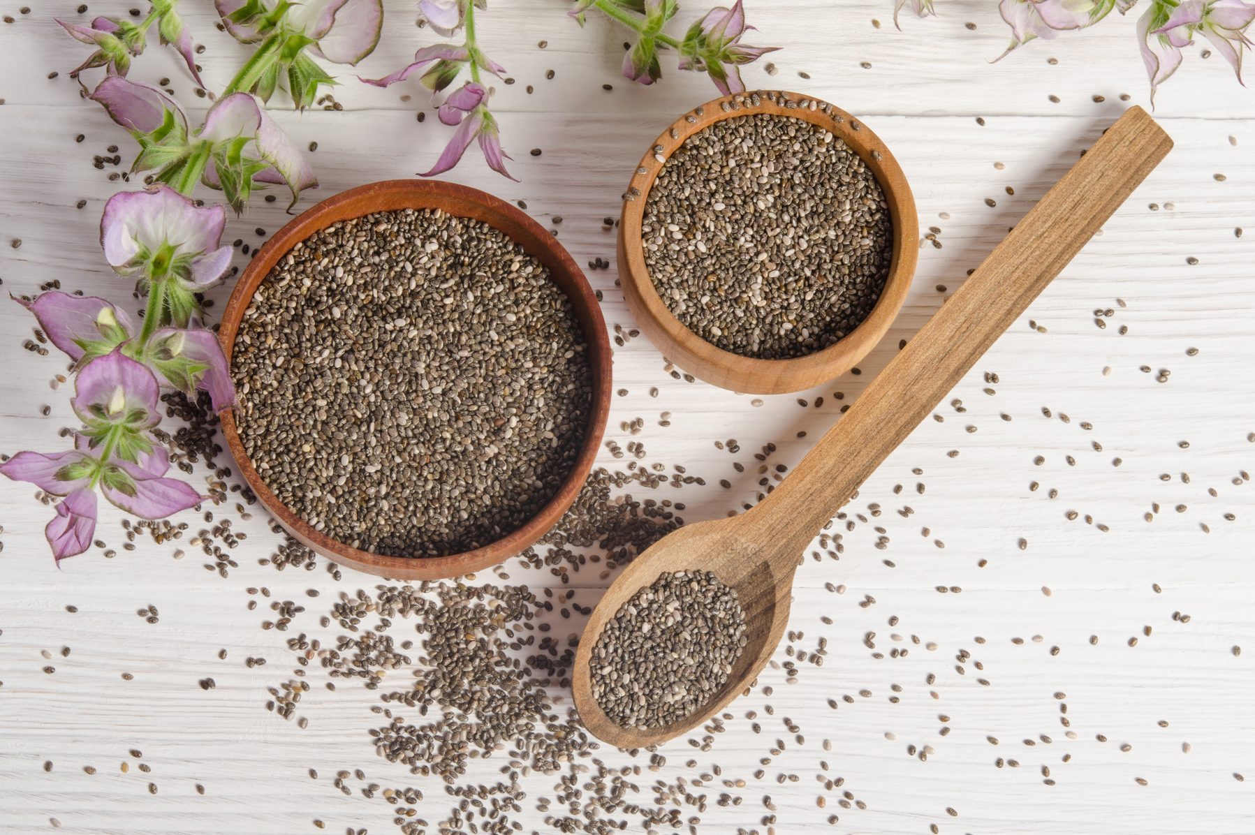 Chia seed healthy super food with flower over white