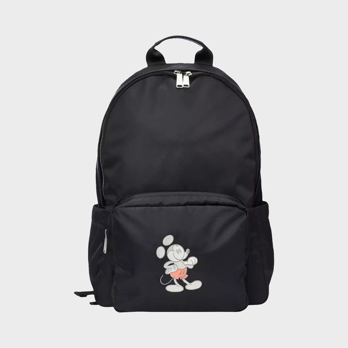 Backpack featuring Mickey Mouse walking, depicted on front pocket, against a plain gray background.