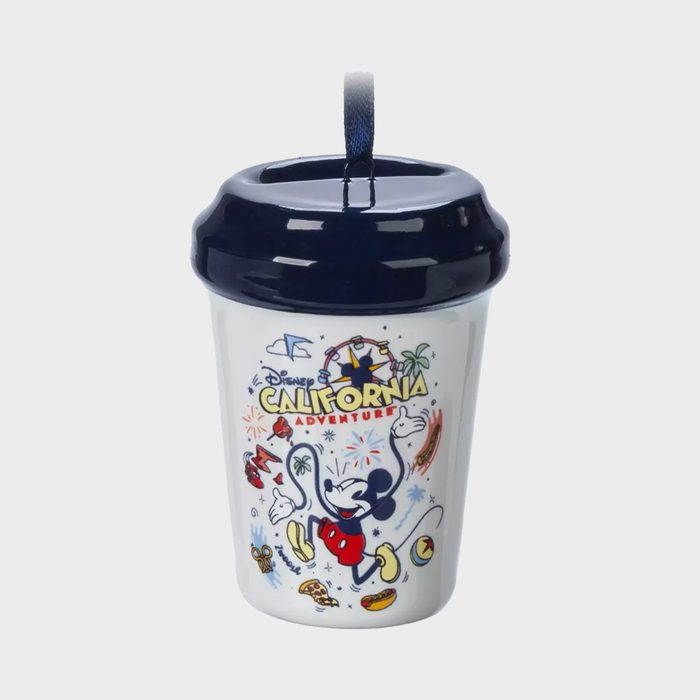 Cup features Disney's California Adventure logo with Mickey Mouse jumping amidst fireworks and theme park elements on a white background, dark blue lid.
