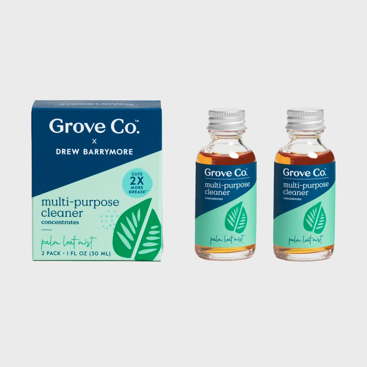 Box and two bottles display multi-purpose cleaner concentrates with green leaf design, labeled "Grove Co. x Drew Barrymore," set against a plain background.