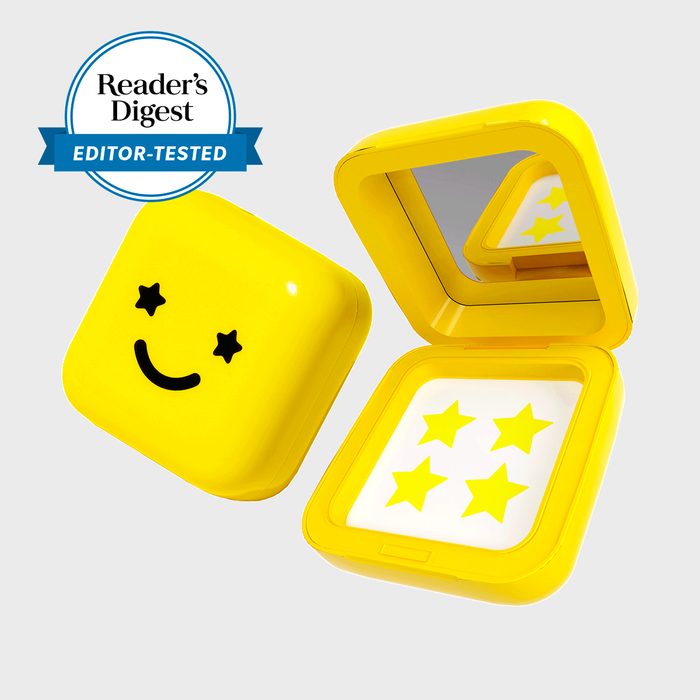 Yellow container with a starry smiley face, opens to reveal four stars and a mirror, labeled 