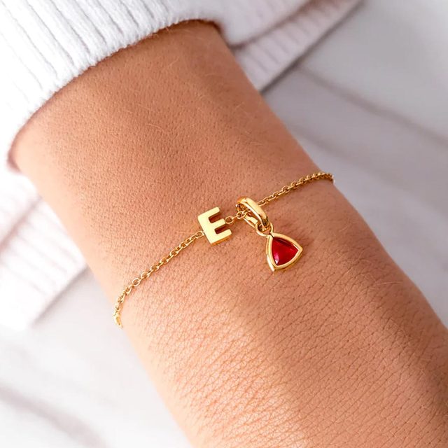 Gold chain bracelet displays letter 