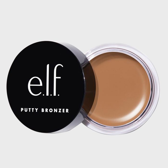 Bronzer in a round, open container with a black lid labeled 