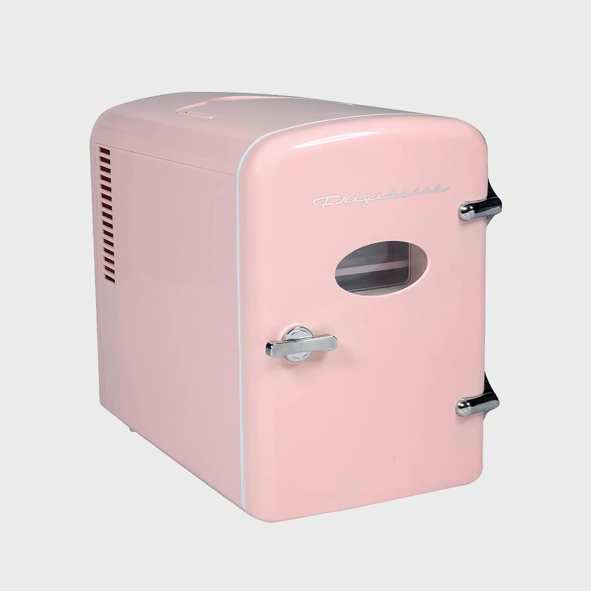 Retro pink mini fridge with chrome handles sits in a simple, plain background. The text "Frigidaire" appears on the door.