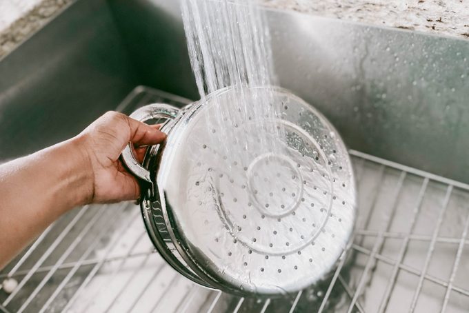 Woman Cleans Steamer Basket