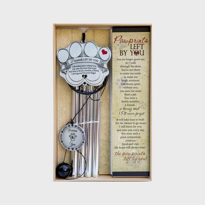 Wind chime with pawprint top hangs in an open box, accompanied by a poem titled 