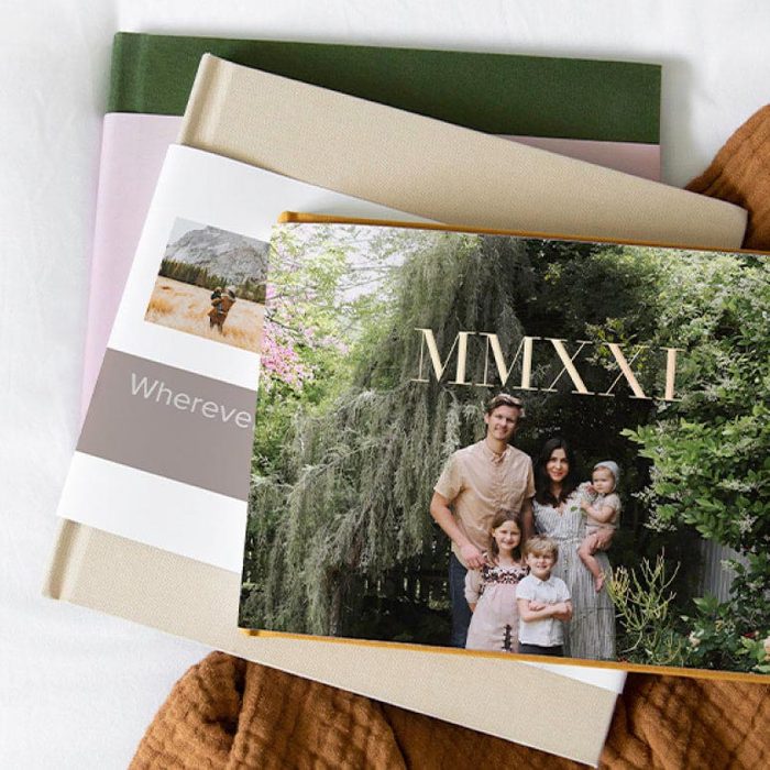 Photobooks stacked, showcasing a family photo with 