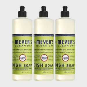 Three dish soap bottles stand side-by-side with green labels, black caps, and 