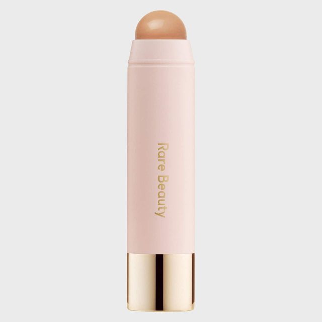 A cream stick stands vertically, displaying 