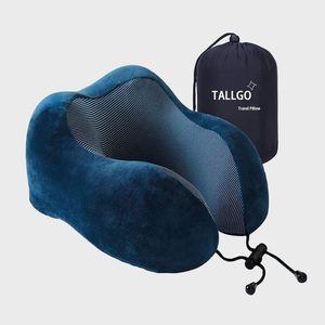 A blue neck pillow rests beside a compact black carrying bag labeled 