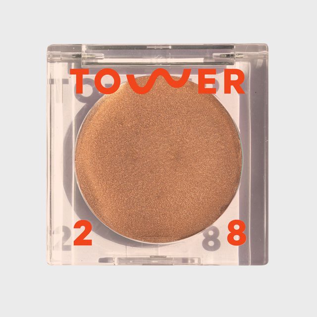 Bronzer sits in clear square compact; labeled 
