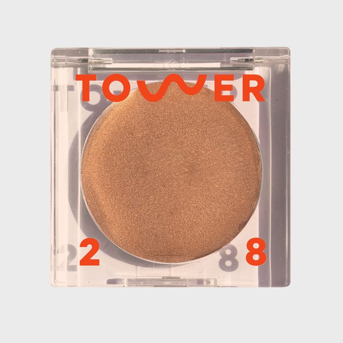 Bronzer sits in clear square compact; labeled 