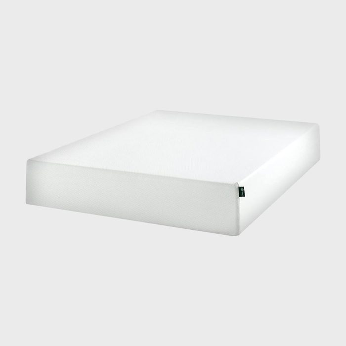 A plain, white mattress rests on a light gray background, showcasing its minimalist design and rectangular shape.