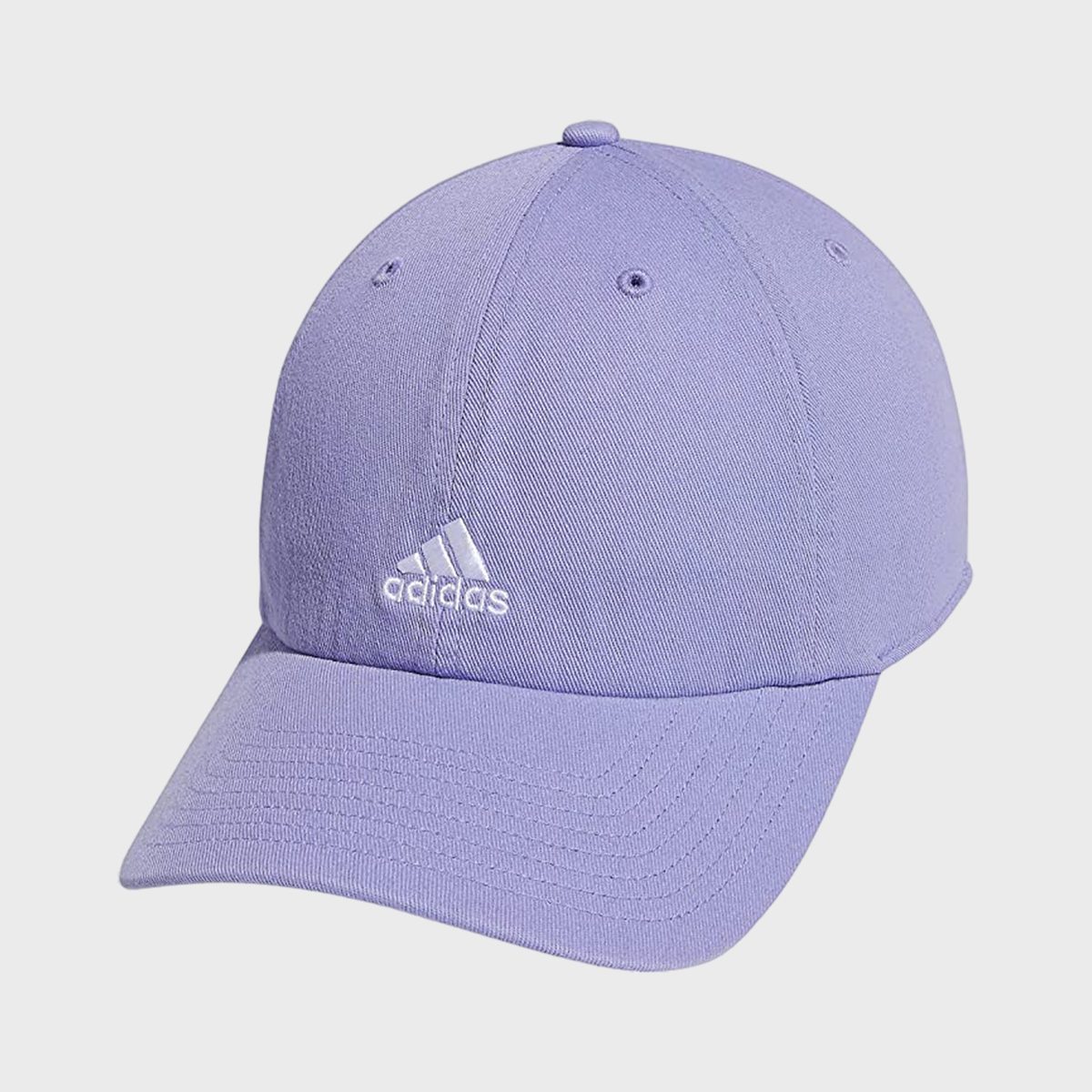 A lavender baseball cap rests on a white background, featuring the Adidas logo stitched in white on the front.