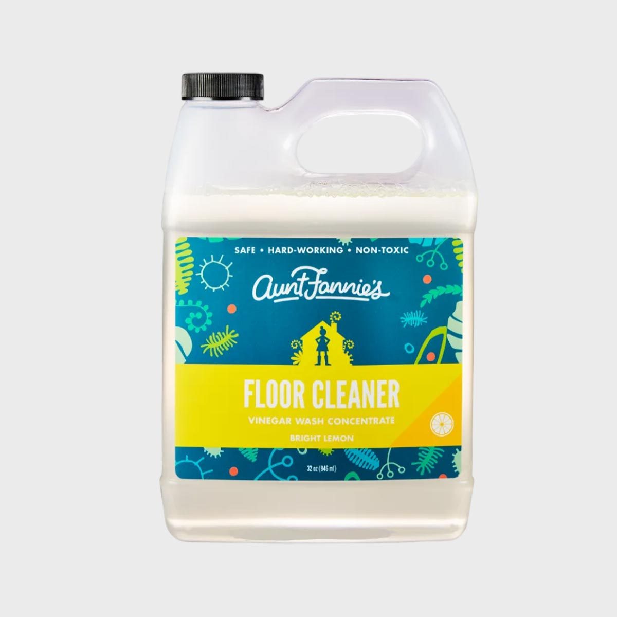 Container displays "Aunt Fannie's Floor Cleaner" label, with bright lemon design, emphasizing non-toxic, hardworking, and safe. Decorated with colorful plant and sun graphics.