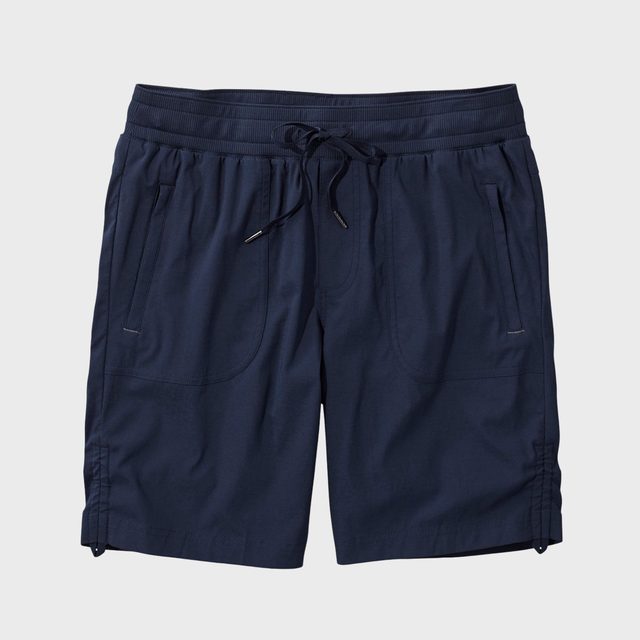 Navy blue shorts with a drawstring waistband, featuring pockets, displayed on a plain white background.