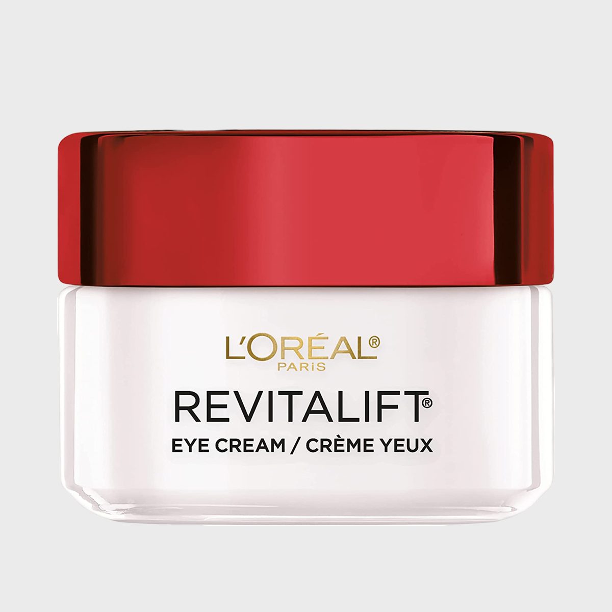Jar with a red lid displaying "L'ORÃ‰AL REVITALIFT EYE CREAM" text on a simple, light gray background.