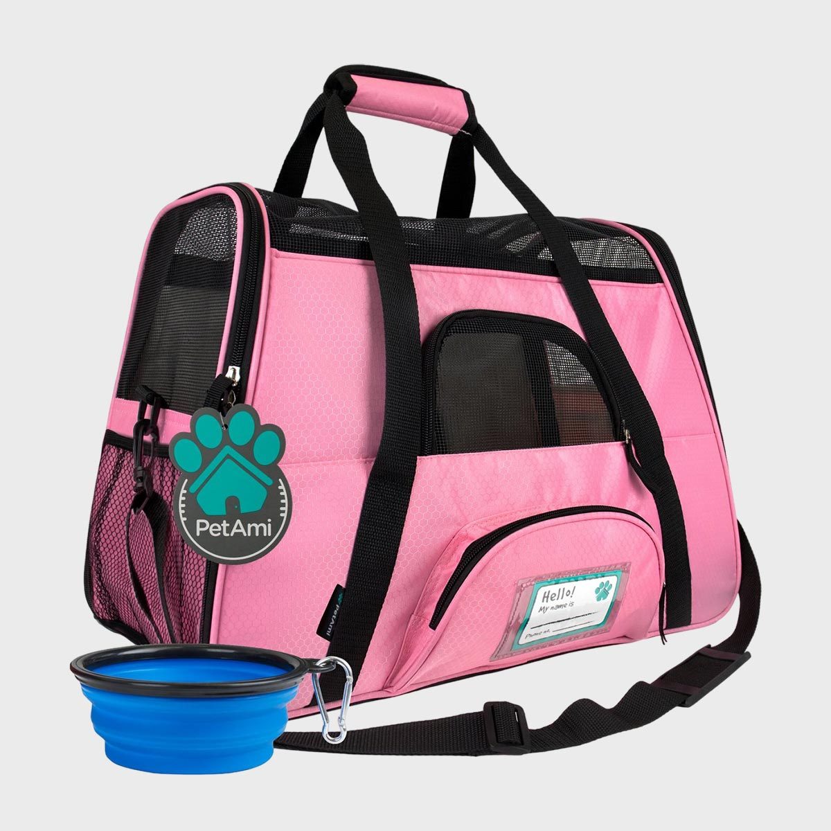 Pink pet carrier resting, featuring mesh windows and pockets, includes a collapsible blue bowl. Text: "PetAmi" and "Hello! My name is".