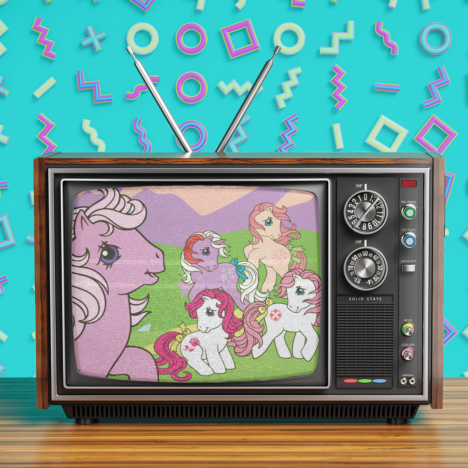 Retro television displays colorful cartoon ponies frolicking in a meadow; background features geometric neon shapes on a turquoise wall.