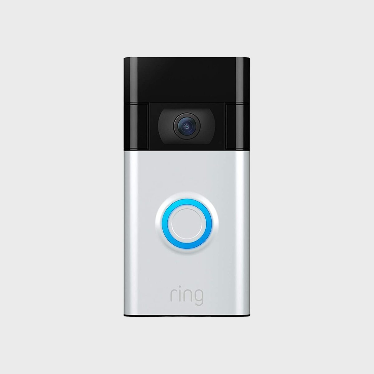 A video doorbell camera with a glowing button sits against a plain background. "Ring" is printed at the bottom.