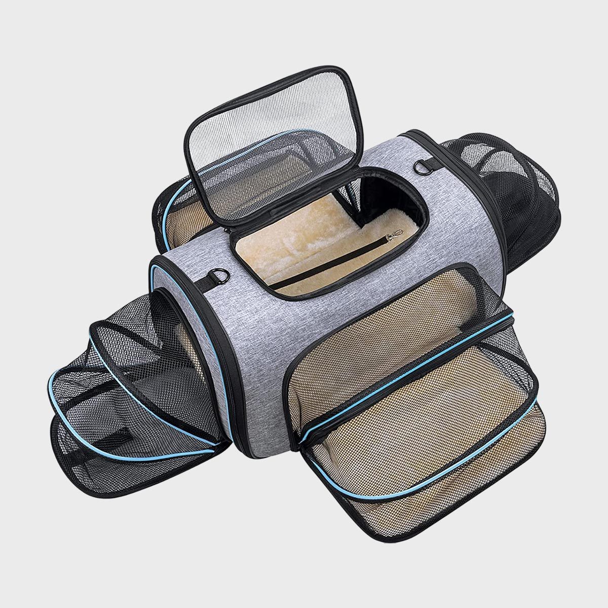 Carrier bag, featuring extended mesh compartments, placed in a neutral space, showcasing its ample ventilated design for small pets.