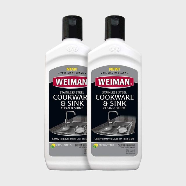 Two white bottles with black caps display 