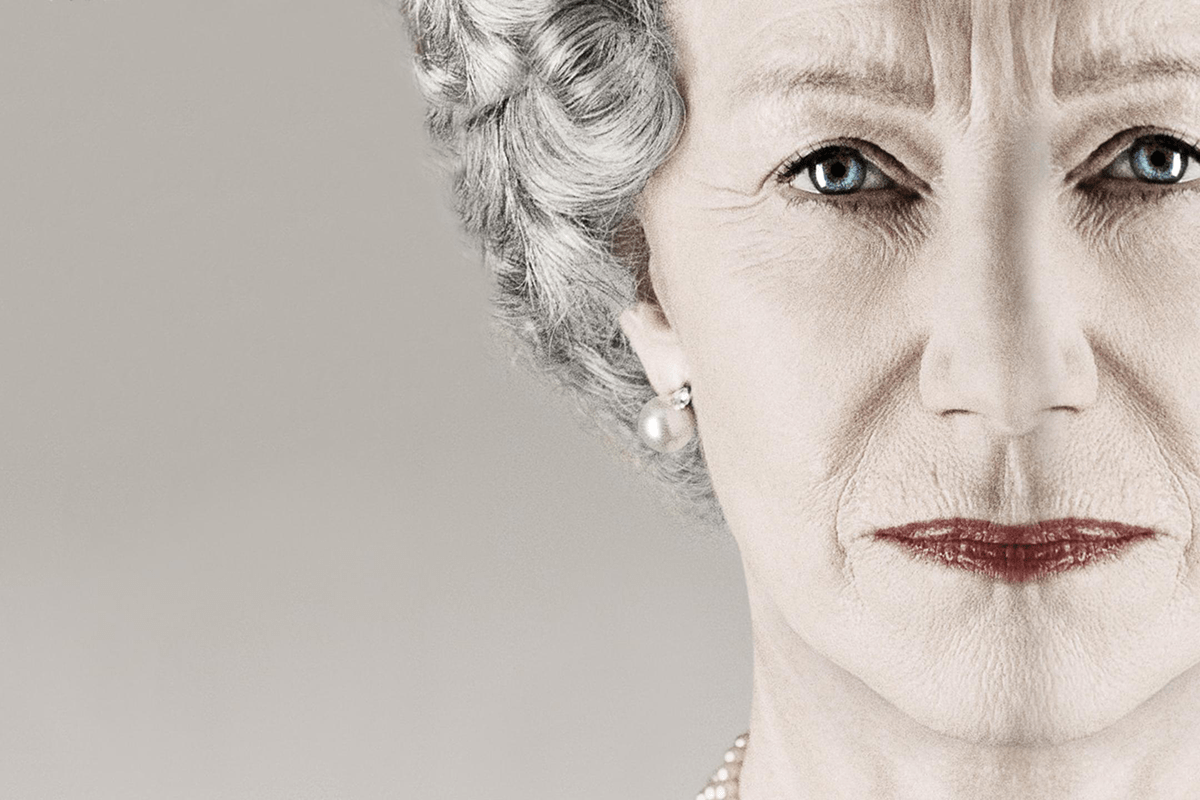 An older woman gazes directly ahead, wearing pearl earrings with soft lighting and a neutral background.