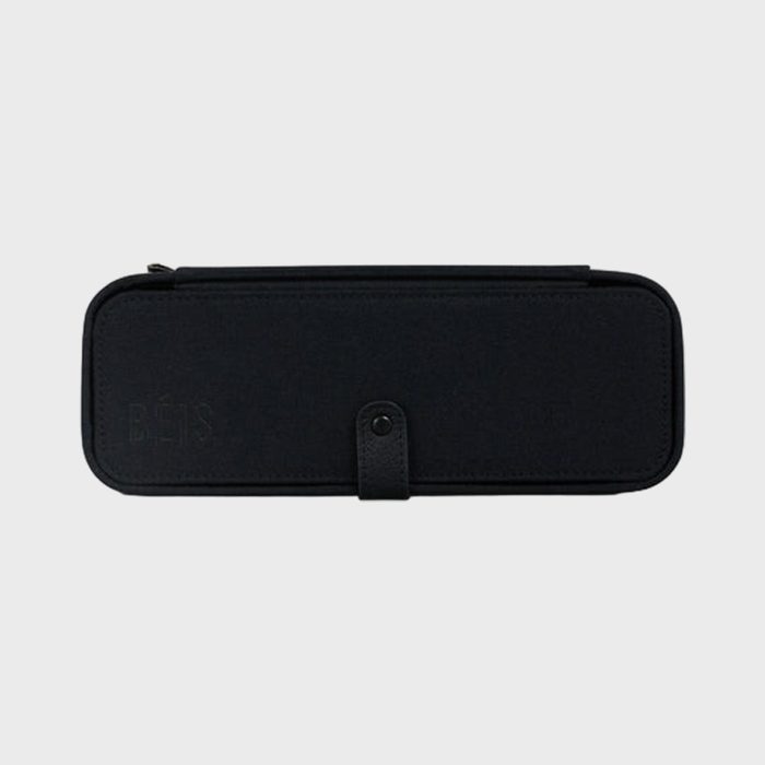 Black rectangular pencil case, closed with a button strap, features 