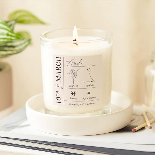 Candle burns gently; label reads 