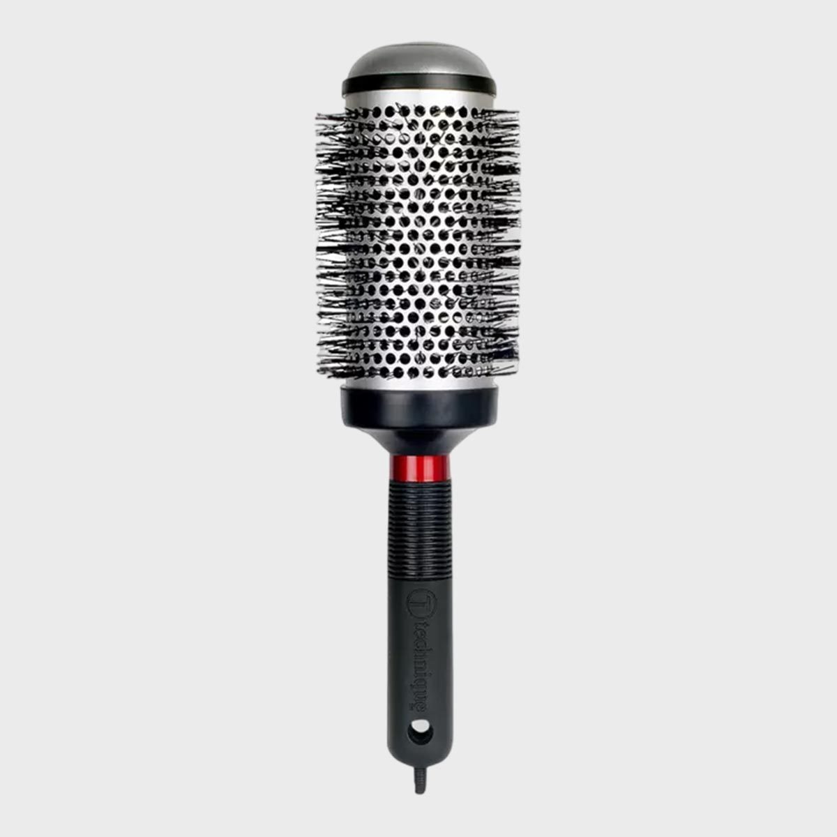 A round hairbrush with a black handle and metal bristles, set against a plain gray background.