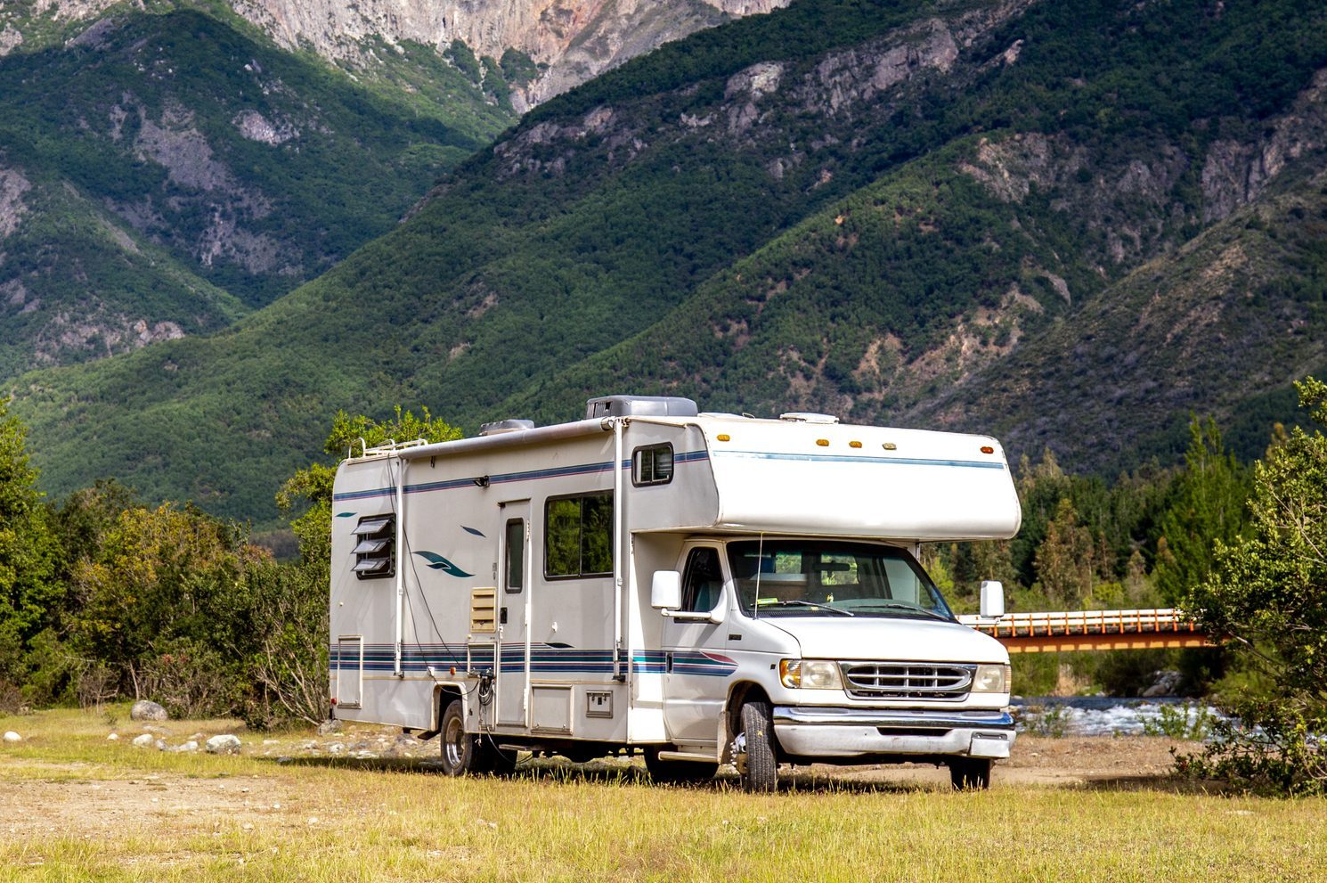 RV parked with beautiful mountain landscape in the background