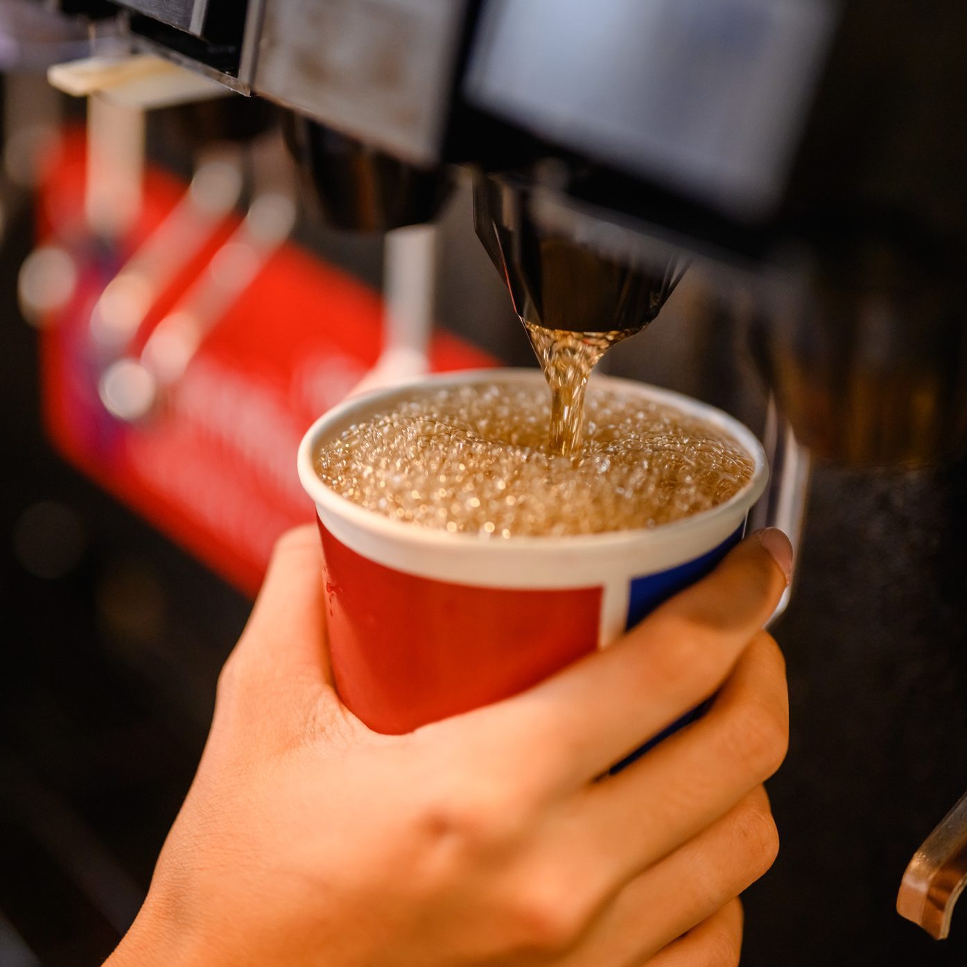 man pours a fizzy drink.sparkling water.cool ice soft drink cola