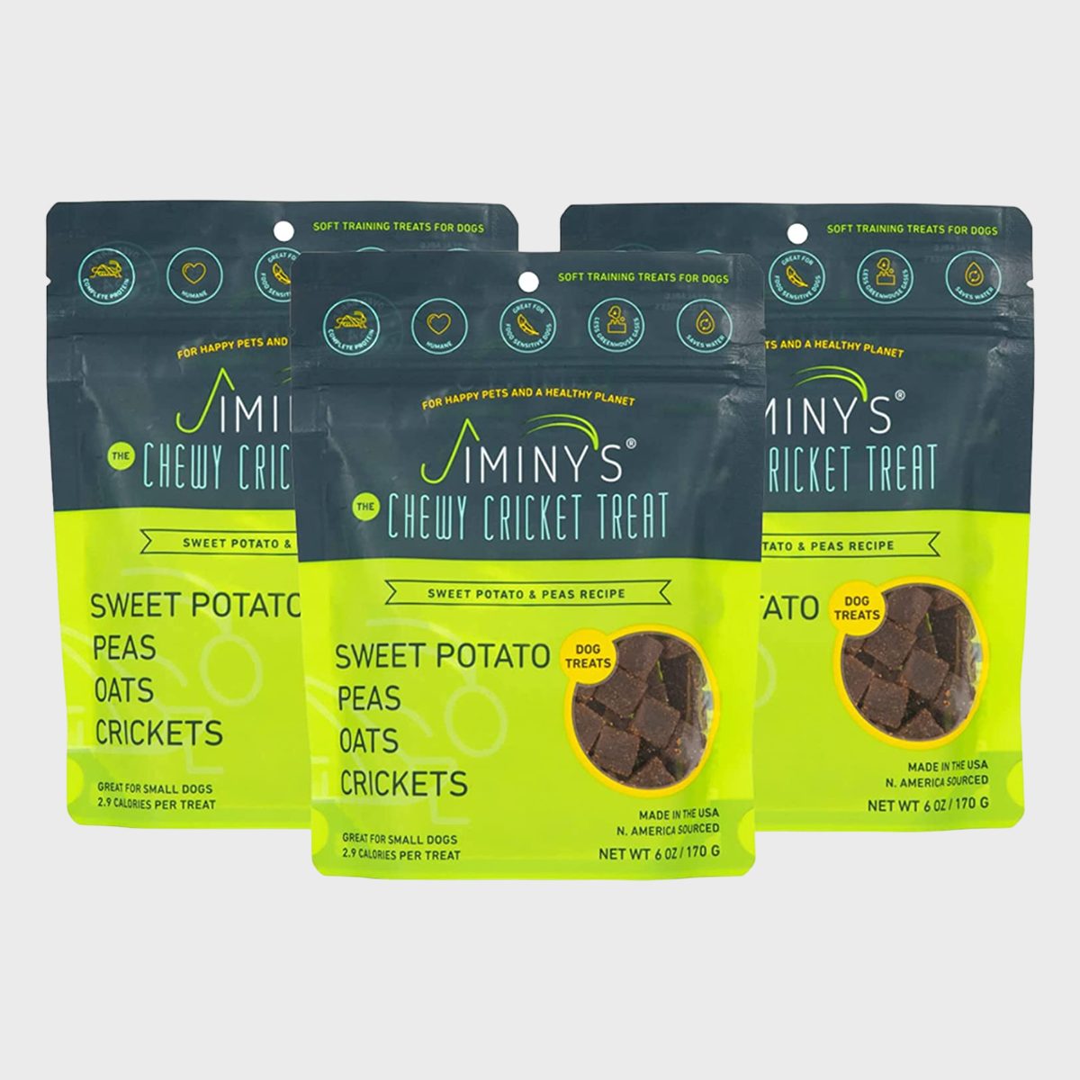 Dog treats, displayed in green and black packaging, labeled "Jiminy's Chewy Cricket Treat," featuring sweet potato, peas, oats, and crickets, for small dogs, 2.9 calories each.