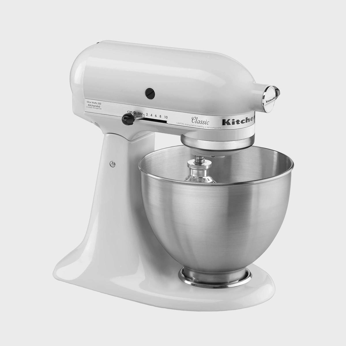 A white stand mixer with a stainless steel bowl sits on a countertop, featuring speed controls and a mixing attachment.
