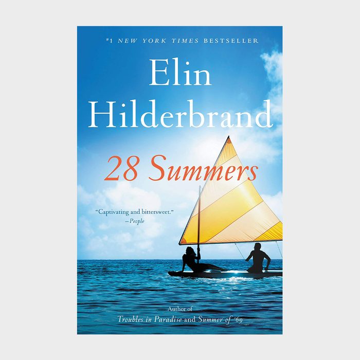Sailboat gently glides across the ocean under a vibrant blue sky. The book cover reads 