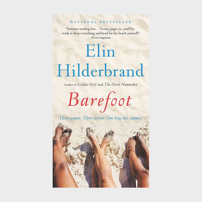 Feet rest on sand; relaxed at the beach. Text: 